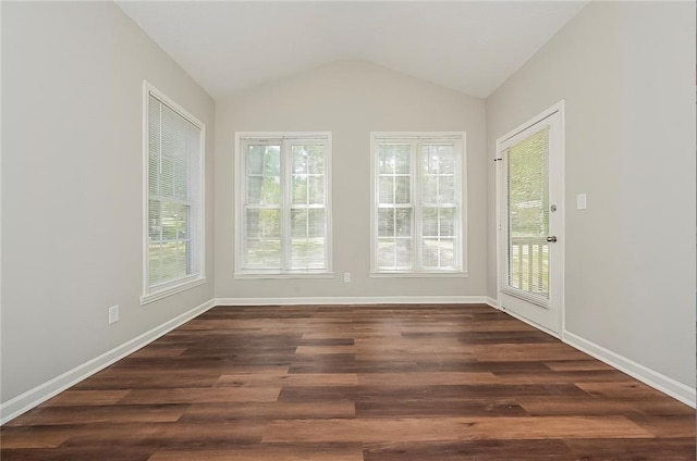 unfurnished sunroom featuring vaulted ceiling