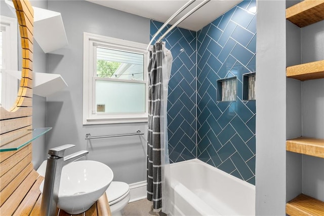 bathroom with shower / tub combo with curtain, a sink, and toilet