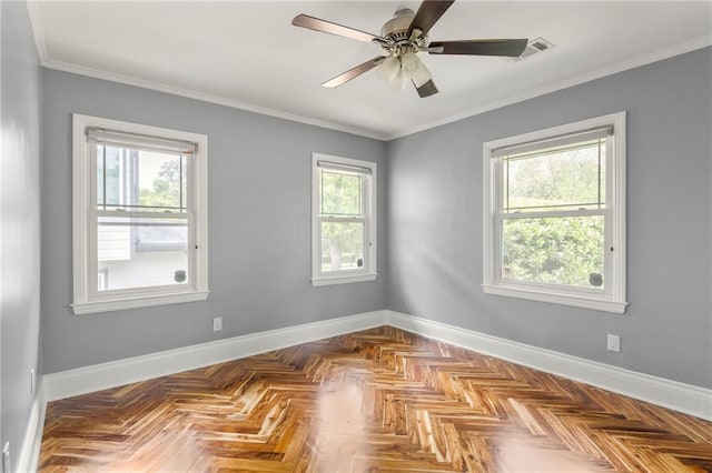 spare room featuring crown molding, a ceiling fan, and baseboards