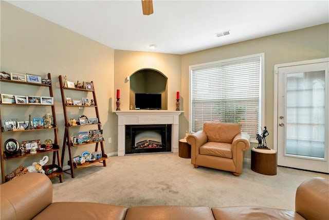 living room featuring ceiling fan and carpet floors