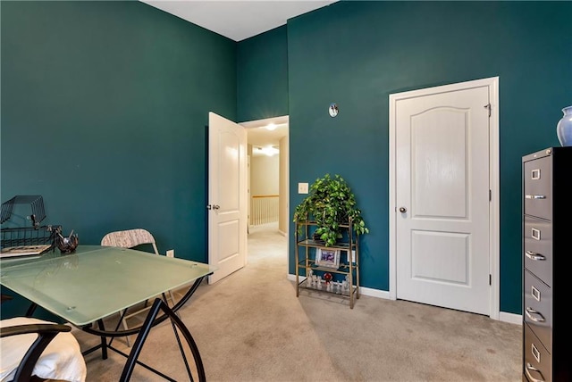 home office featuring light colored carpet