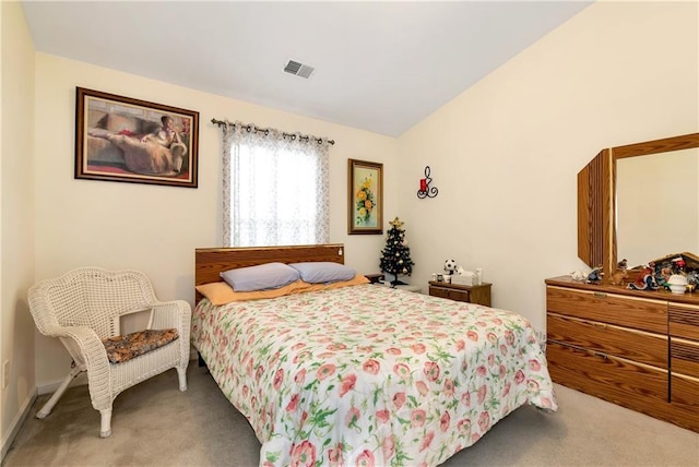 bedroom featuring carpet flooring and lofted ceiling