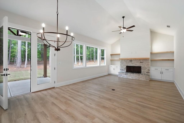 130 Doris Path, Dallas, GA 30157 - unfurnished living room featuring light wood-style flooring, a ceiling fan, a fireplace, a chandelier, and high vaulted ceiling