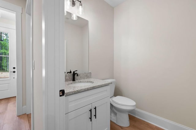 130 Doris Path, Dallas, GA 30157 - bathroom with wood finished floors, toilet, vanity, and baseboards
