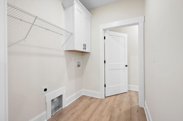 130 Doris Path, Dallas, GA 30157 - clothes washing area featuring hookup for an electric dryer, cabinet space, light wood-style floors, baseboards, and washer hookup