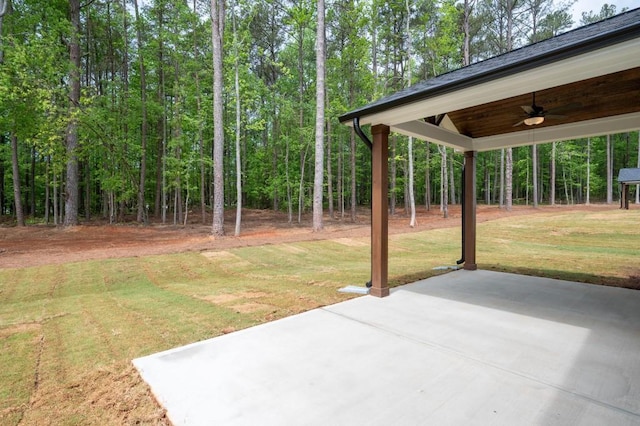 130 Doris Path, Dallas, GA 30157 - view of grassy yard with ceiling fan, a patio, and a forest view