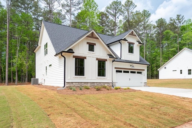 130 Doris Path, Dallas, GA 30157 - modern farmhouse style home featuring driveway, a garage, a shingled roof, board and batten siding, and a front yard