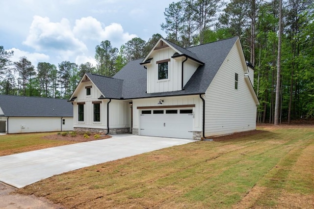 130 Doris Path, Dallas, GA 30157 - modern inspired farmhouse featuring board and batten siding, concrete driveway, a shingled roof, a garage, and a front yard