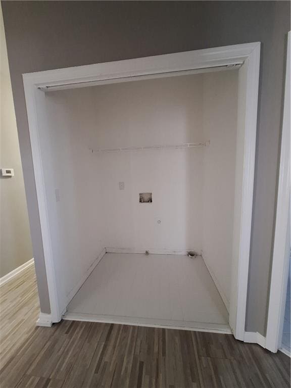 laundry area featuring dark wood-type flooring