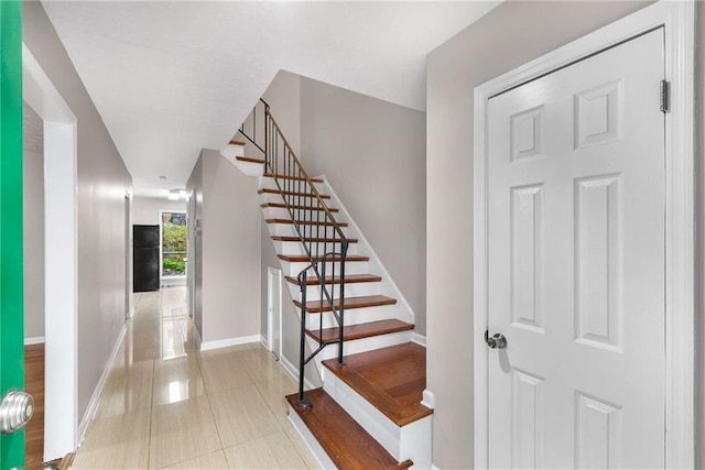 2340 Beaver Ruin Rd Unit 68, Norcross, GA 30071 - stairs with baseboards and tile patterned floors