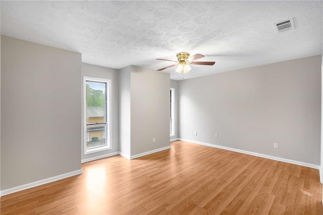2340 Beaver Ruin Rd Unit 68, Norcross, GA 30071 - unfurnished room featuring a ceiling fan, light wood-type flooring, baseboards, and a textured ceiling
