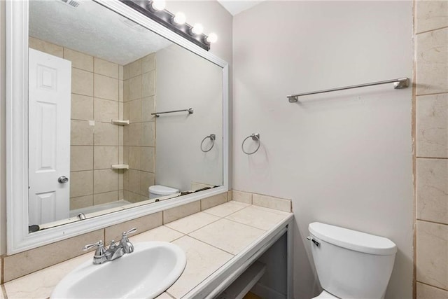2340 Beaver Ruin Rd Unit 68, Norcross, GA 30071 - bathroom featuring toilet and vanity