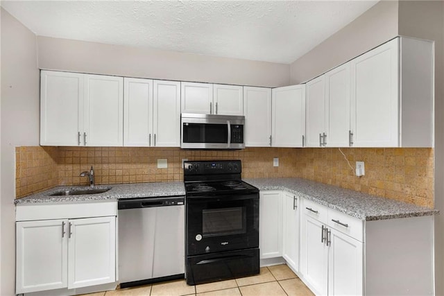 2340 Beaver Ruin Rd Unit 68, Norcross, GA 30071 - kitchen with appliances with stainless steel finishes, a sink, and white cabinetry
