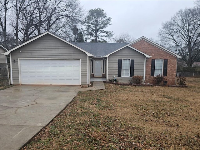 single story home with a garage and a front yard