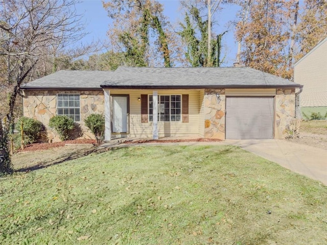 ranch-style home with a front yard and a garage