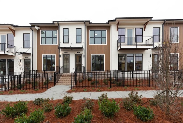 view of front of home with a balcony