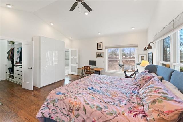 bedroom with a walk in closet, recessed lighting, a ceiling fan, wood finished floors, and high vaulted ceiling