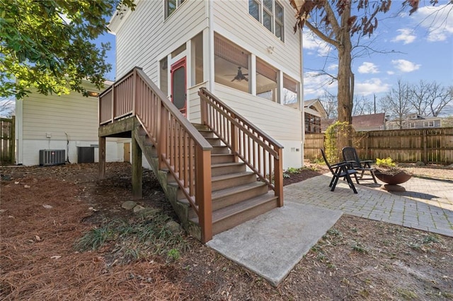 exterior space with a patio area, fence, and cooling unit