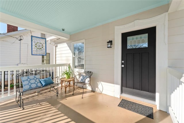 property entrance featuring a porch