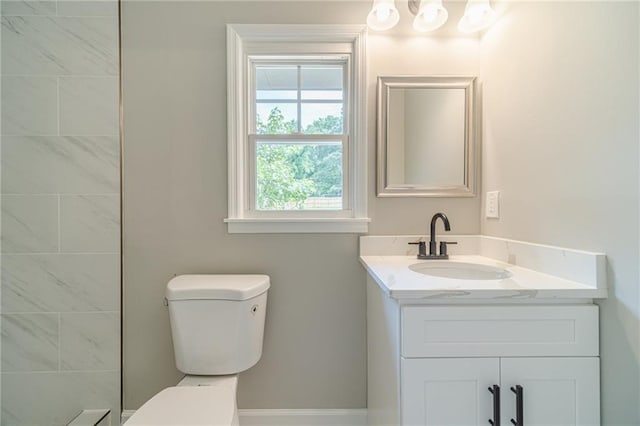bathroom featuring toilet and vanity