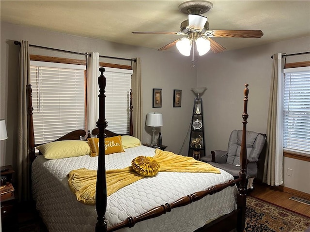 bedroom featuring ceiling fan and dark hardwood / wood-style flooring