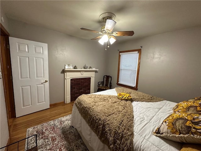 bedroom featuring ceiling fan and wood-type flooring