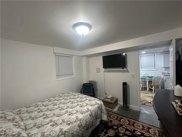 bedroom featuring concrete floors