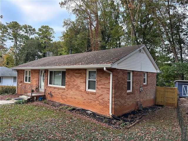 view of front of house with a shed