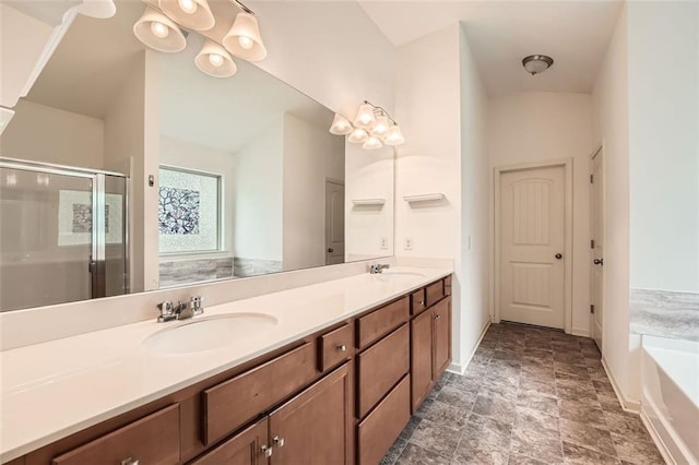 full bath featuring a stall shower, a garden tub, double vanity, and a sink