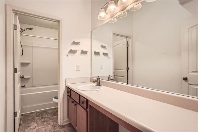 bathroom with bathing tub / shower combination, vanity, and toilet