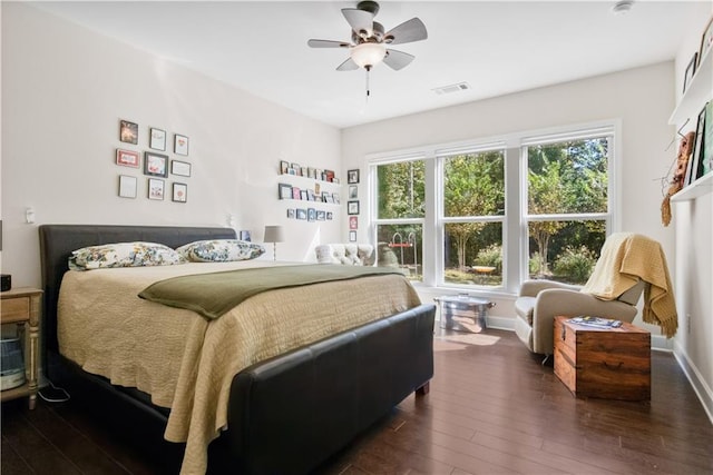 bedroom with dark wood-type flooring and ceiling fan