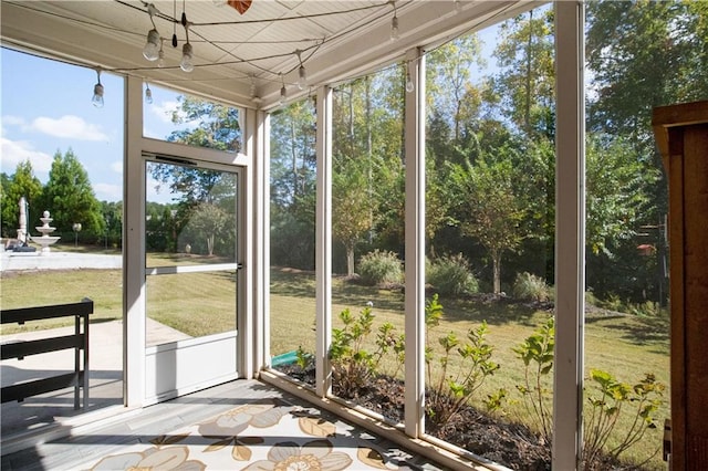 sunroom / solarium featuring a healthy amount of sunlight