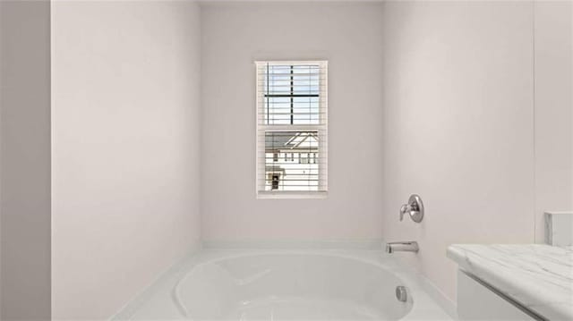 bathroom featuring a tub to relax in