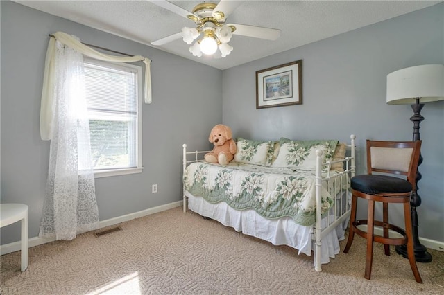 bedroom featuring light colored carpet and ceiling fan