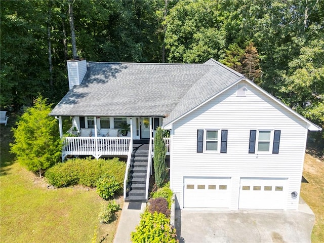 view of front of home featuring a garage and a porch