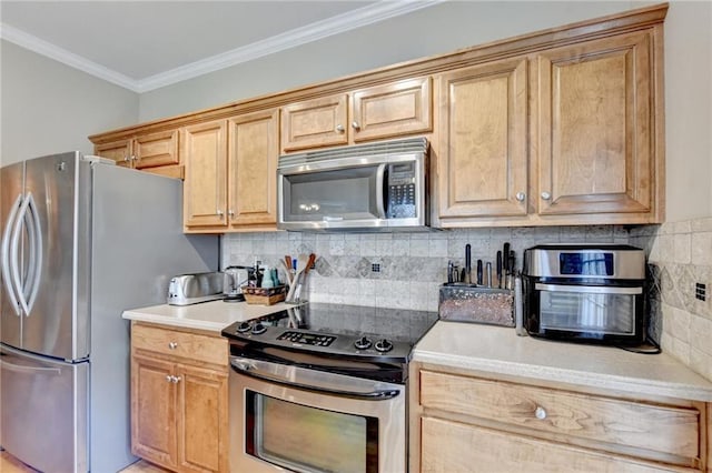 39 Legendary Dr, Hoschton, GA 30548 - kitchen featuring appliances with stainless steel finishes, backsplash, crown molding, and light countertops