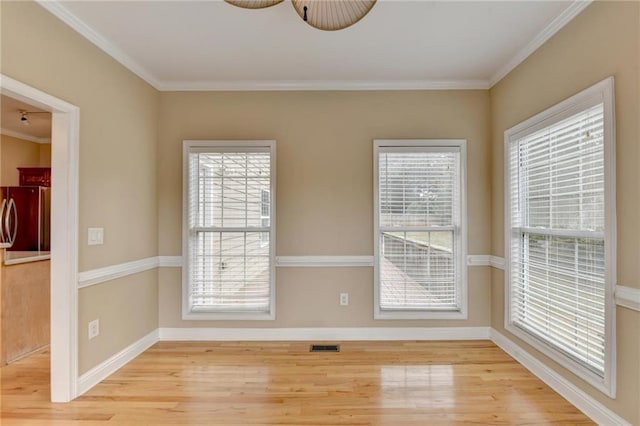 39 Legendary Dr, Hoschton, GA 30548 - empty room featuring wood finished floors, healthy amount of natural light, and ornamental molding