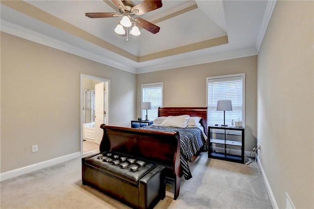 39 Legendary Dr, Hoschton, GA 30548 - bedroom featuring light colored carpet, ornamental molding, a raised ceiling, a ceiling fan, and connected bathroom