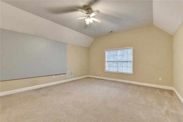 39 Legendary Dr, Hoschton, GA 30548 - additional living space with vaulted ceiling, carpet, and a ceiling fan