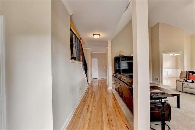 39 Legendary Dr, Hoschton, GA 30548 - hall featuring light wood-type flooring and a chandelier