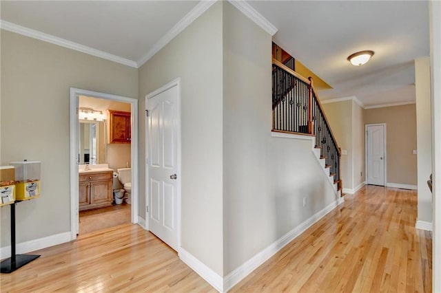 39 Legendary Dr, Hoschton, GA 30548 - hall featuring light wood finished floors, stairs, and ornamental molding