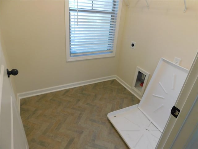 washroom featuring laundry area, hookup for an electric dryer, and baseboards