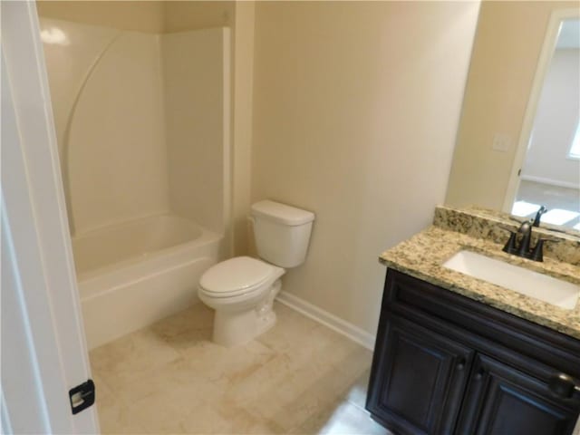 bathroom with shower / tub combination, vanity, toilet, and baseboards