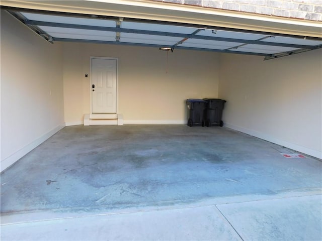 garage featuring baseboards