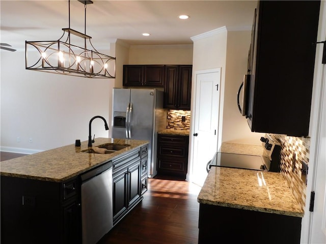 kitchen featuring decorative backsplash, appliances with stainless steel finishes, dark wood-style flooring, crown molding, and a sink