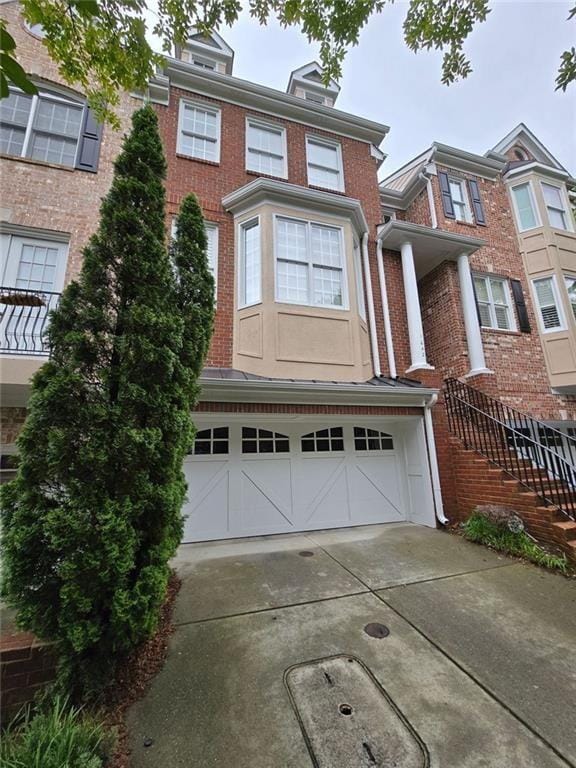 1042 Emory Parc Pl, Decatur, GA 30033 - multi unit property with brick siding, driveway, and a garage