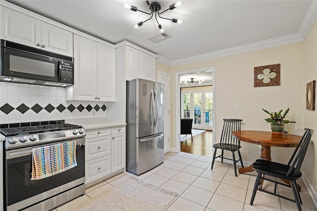 869 Briarcliff Rd NE Unit B20, Atlanta, GA 30306 - kitchen with appliances with stainless steel finishes, french doors, decorative backsplash, ornamental molding, and light countertops