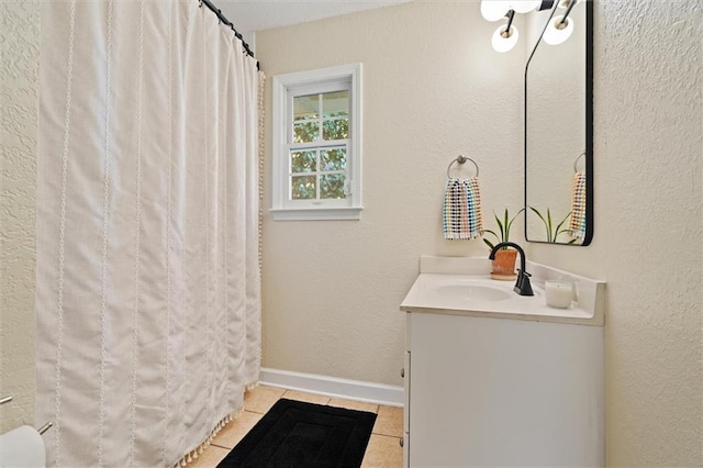 869 Briarcliff Rd NE Unit B20, Atlanta, GA 30306 - bathroom featuring tile patterned floors, vanity, baseboards, and a shower with curtain