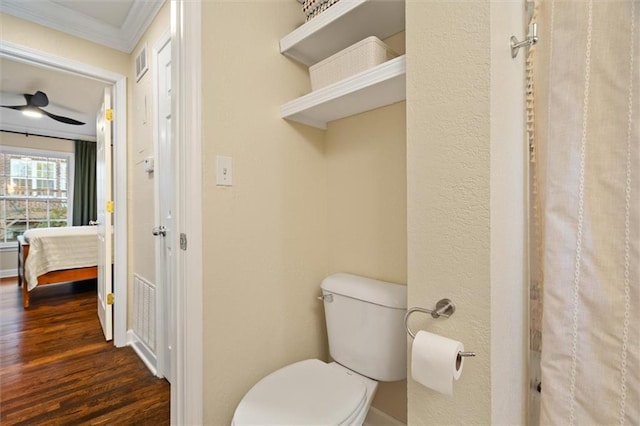 869 Briarcliff Rd NE Unit B20, Atlanta, GA 30306 - full bathroom with wood finished floors, toilet, crown molding, a shower with curtain, and baseboards