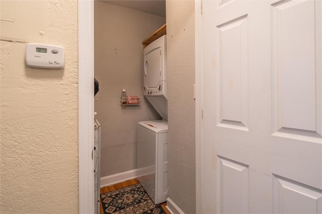 869 Briarcliff Rd NE Unit B20, Atlanta, GA 30306 - laundry room featuring estacked washer and dryer, wood finished floors, and a textured wall